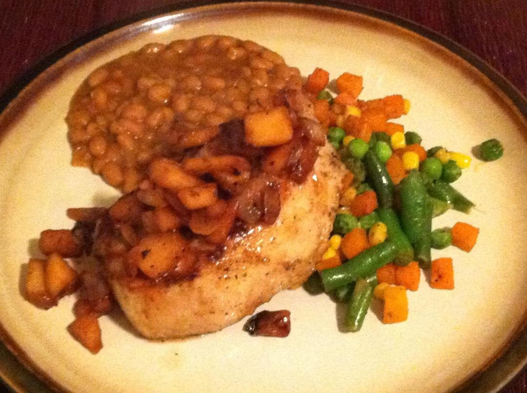 Pork with a red apple onion cranberry juice infused topping. With baked beans and seasoned mixed veggies. To everyone who thinks we eat out to much and I don't cook enough at home. I win