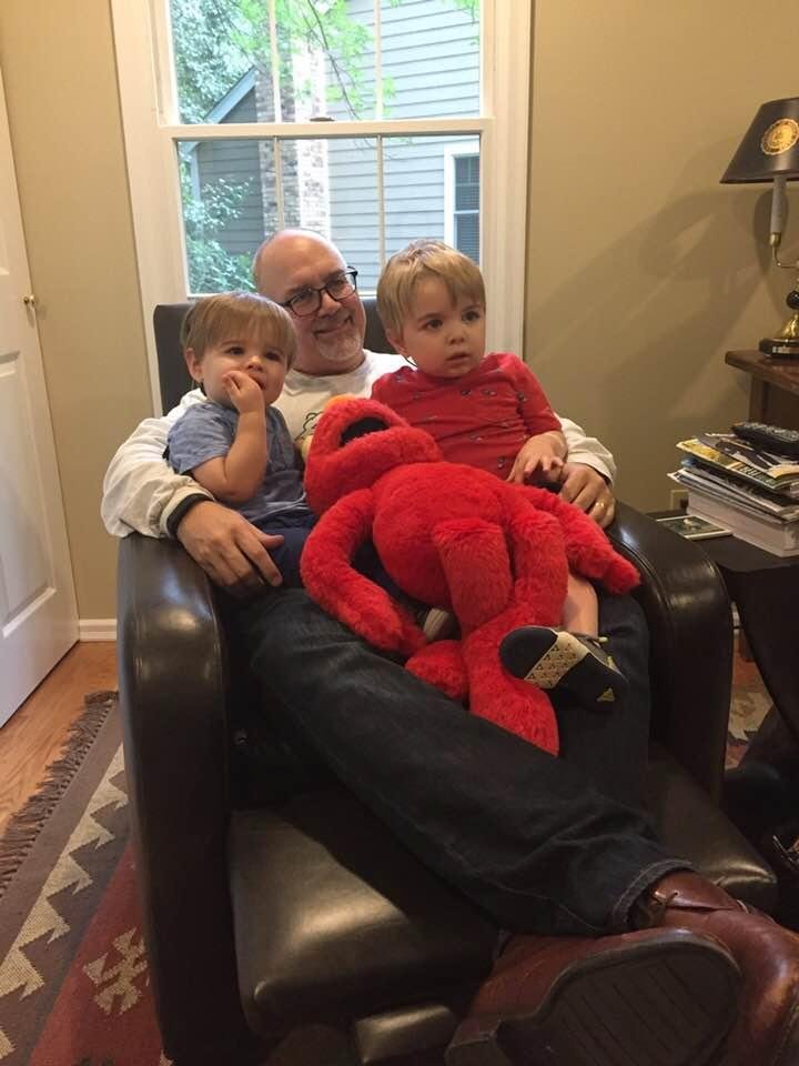 Watching television with the boys and Elmo.