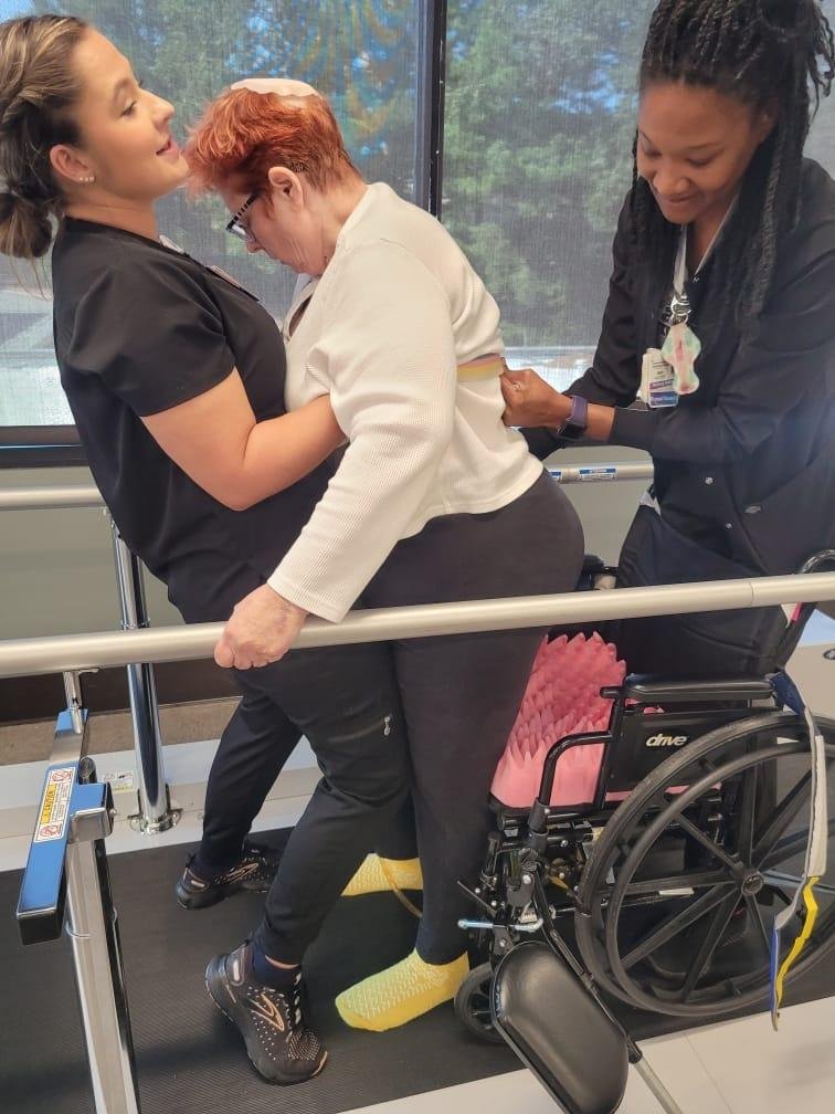 GAIL with physical therapists today. She stood with their help 3 times!