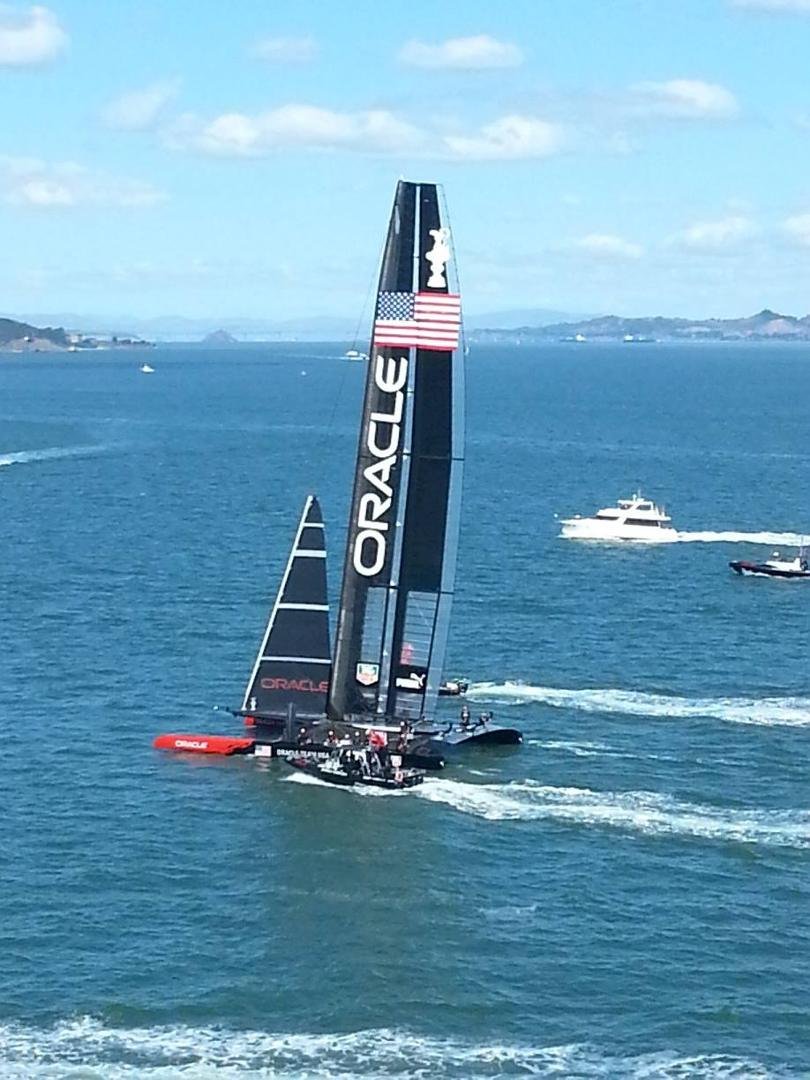 On bow of cruise ship to watch final race of America's Cup. USA vs New Zealand. US came back from being down 8 - 1 to tie it up at 8 -8.