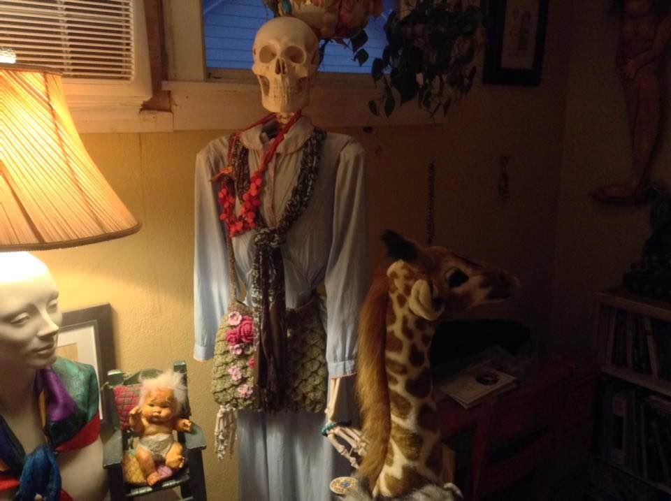 This picture is of an area in the living room. I don't know how to explain. It just is what it is. Oh, not to mention I didn't arrange anything or even fix the skeleton's necklace so it hung straight. And I should hang