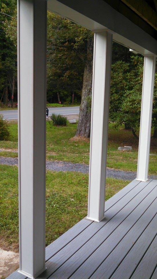 Crown, corner and cove moldings installed on porch posts.