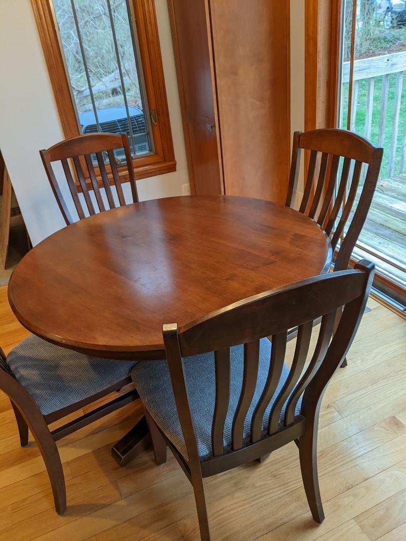 Amish-made 42" dining room table with 4 chairs.