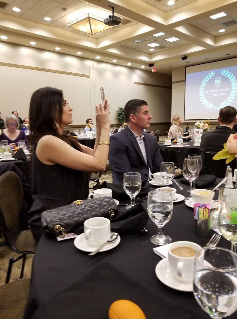 The proud family of Frank and Marta Dudowicz watch as they receive the chambers small business of the Year award. Their daughter Leah and her husband Bob. Bob is the General Manager for Kwik Kar Denton. Take your vehicle he