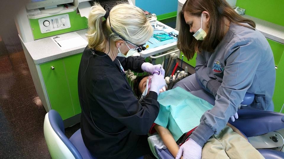 Here's Jonathan getting his teeth made pretty. He actually likes his dentist.. By the way, she's the blond.. He likes em all.. but especially the blonds..