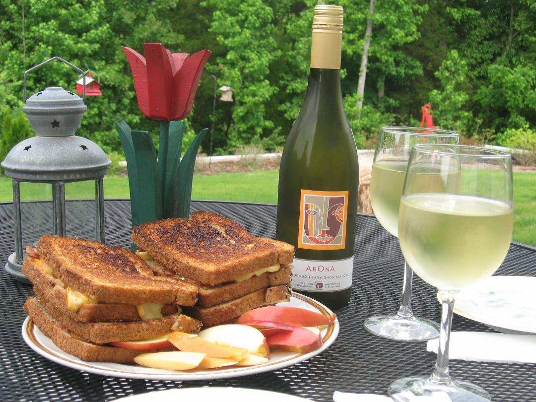 Had a wonderful meal with my wonderful wife yesterday. Had to share. The sandwiches contain grilled smoked gouda, bacon, and apple. The wine was a fine sauvignon blanc from New Zealand.