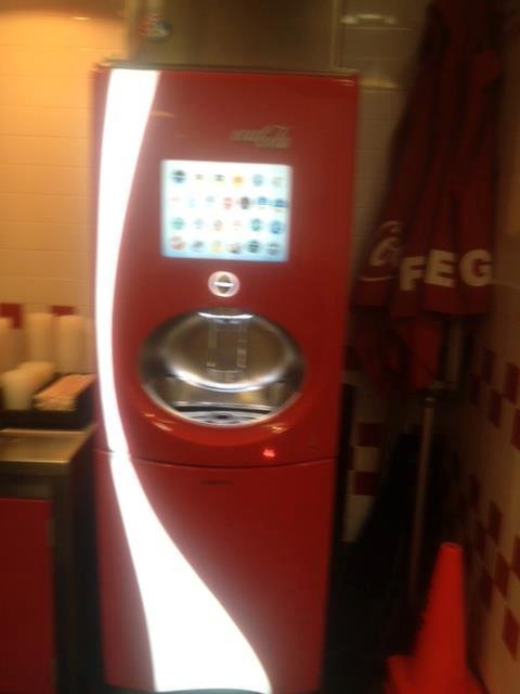 One of 2 Coke machines in 5 guys.  The designer's logo is in the next picture.