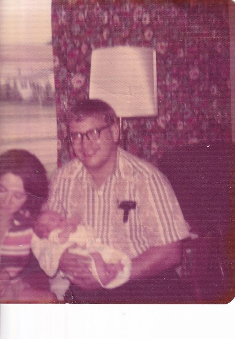 Here is an August 1975 shot of me, Deb,young Robbie and newborn Elizabeth (Betsy) in our present home.