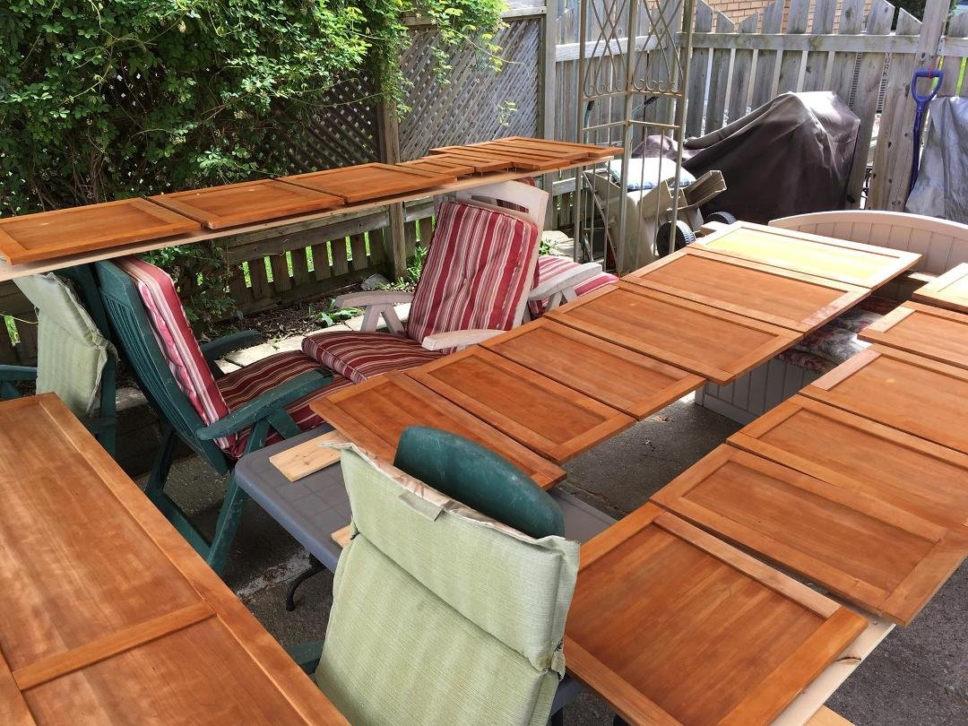 Following assembly and stain the doors are drying under the gazebo awning.