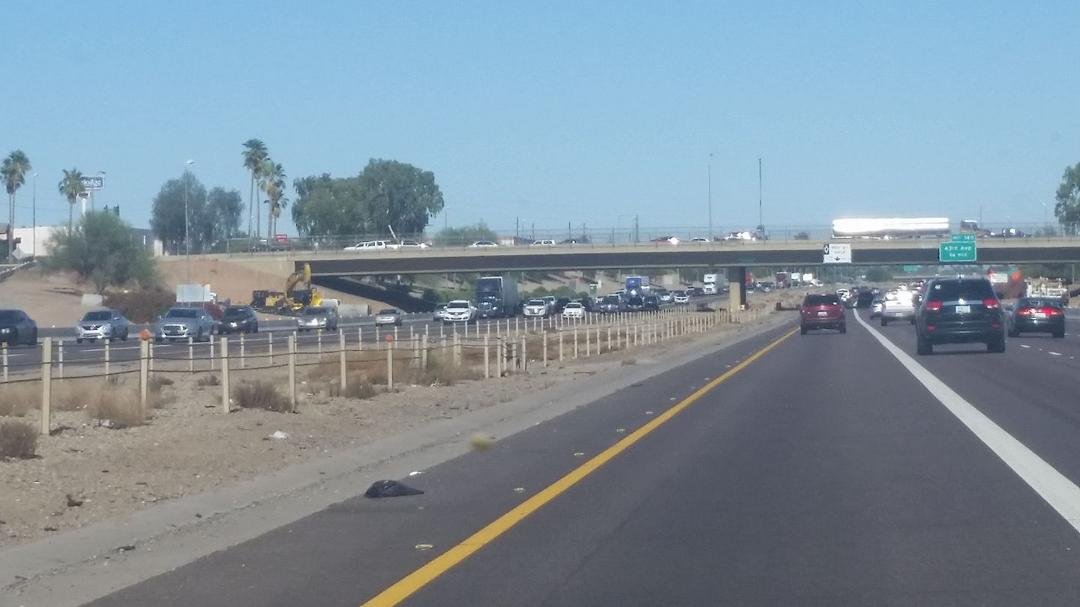 Phoenix, Arizona has more cars on the road going to the airport than Perry has in the whole town! Great, just drove by an interstate warning sign that states there is an accident requiring a Hazmat crew!