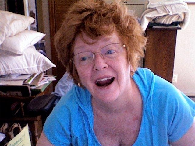 Fran trying to figure out this camera on the computer....surrounded by the usual CRAP.
