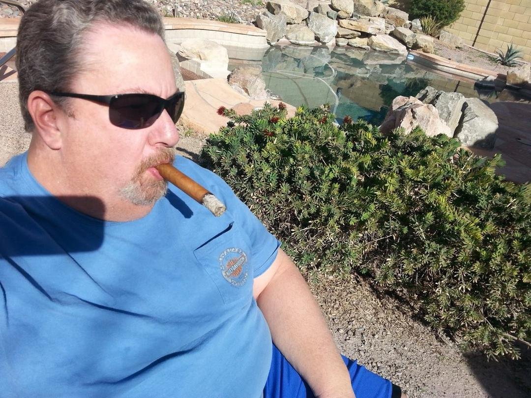 Relaxing on patio next to pool on a nice wintery day in tbe upper 70's enjoying a good cigar and listening to classic rock