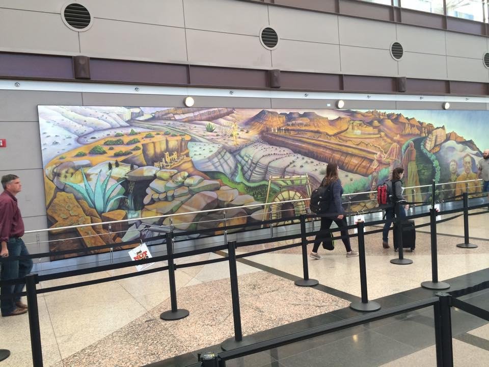 Large mural in the Denver Airport showing Aztec ruins and Hispanic heritage .
Look close for hidden pics , and symbolism !