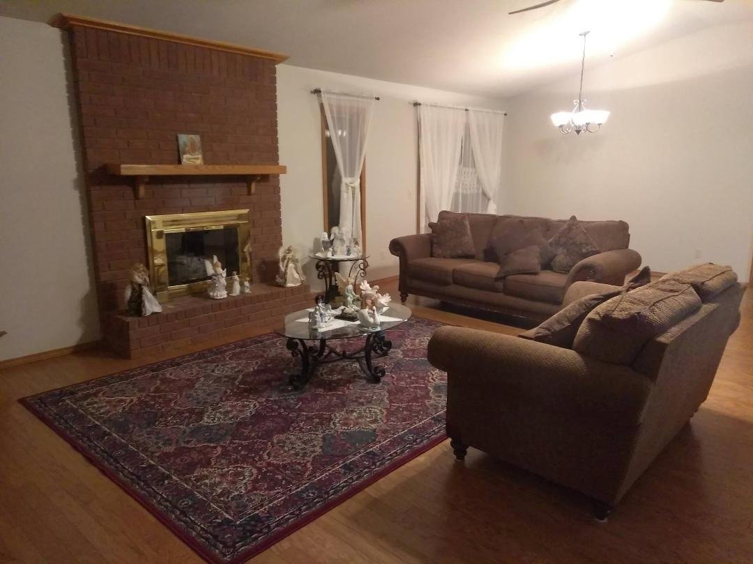 This is one view of the living room in our new home. As I knew would happen, Veronica is hinting that we need new furniture more in keeping with the style of home we are in. As I collect good photos of the rest of the house