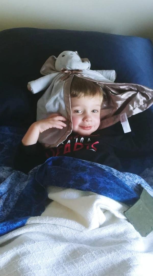 Playing peekaboo with his nap buddy, Ellie.