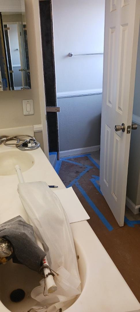 Repairs that Christi Galla had to do. The repairs to the Master Bathroom that needed to be done to install a glass door in the shower