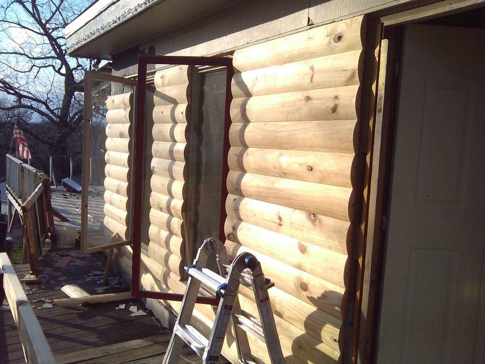 New "Log" siding, and windows.