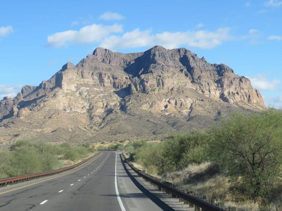Took this picture on my way to Globe Arizona. It kind of resembles the background from the movie Forrest Gump, when Forest was running across the country