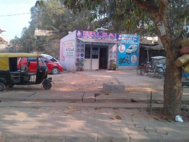 Indian driving school. Really? They must learn how to keep their horns down and avoid hitting the bikes.
