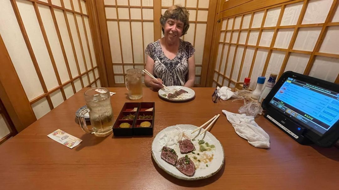 One of our not-so-successful evenings dining out on our own. We found a resto that seated us in these little shoji-screen cubicles: cute.
But you had to order via that monitor on the right; not so good. After several fail