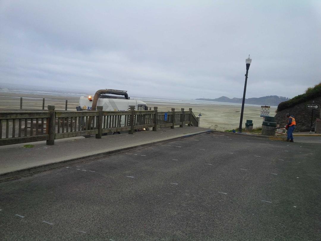 Cleaning and painting the parking lot at the Nye Beach turnaround.
