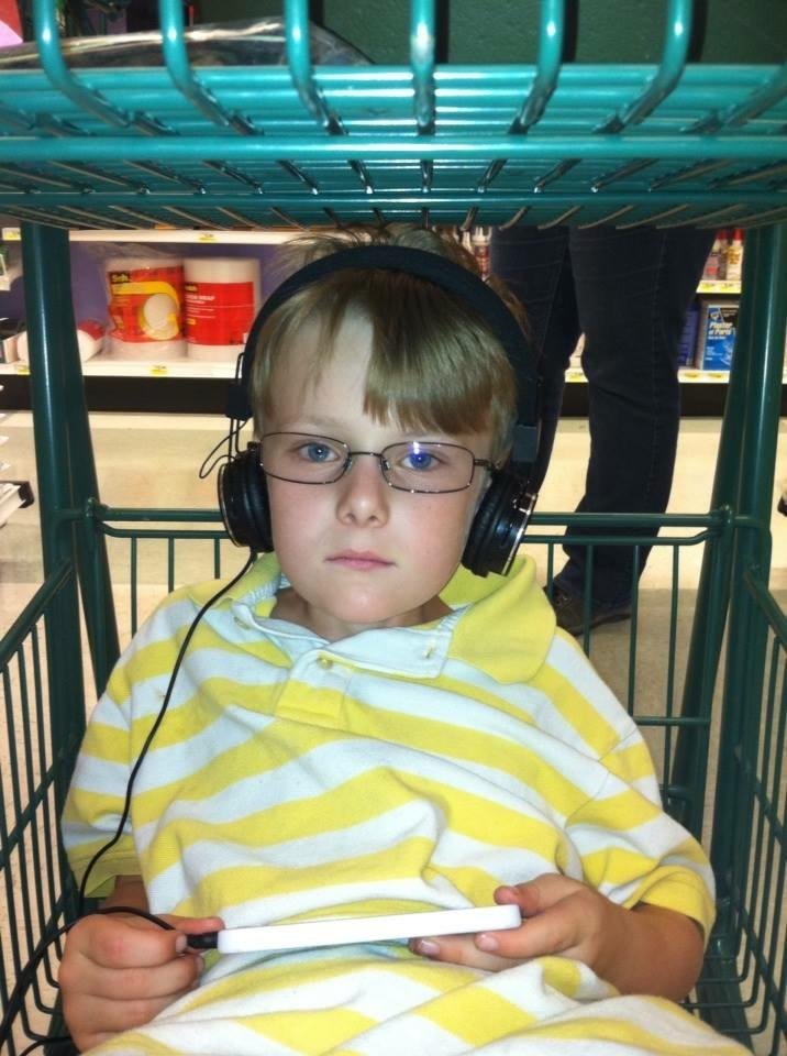 This is how my beautiful grandson Rayden helps me shop...he's my backup navigation...lol ❤️