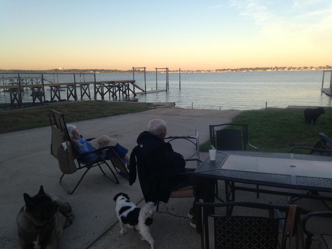 Last picture of mom and dad by the new house. All he wanted to do is sit by the water and "hang" with the dogs.