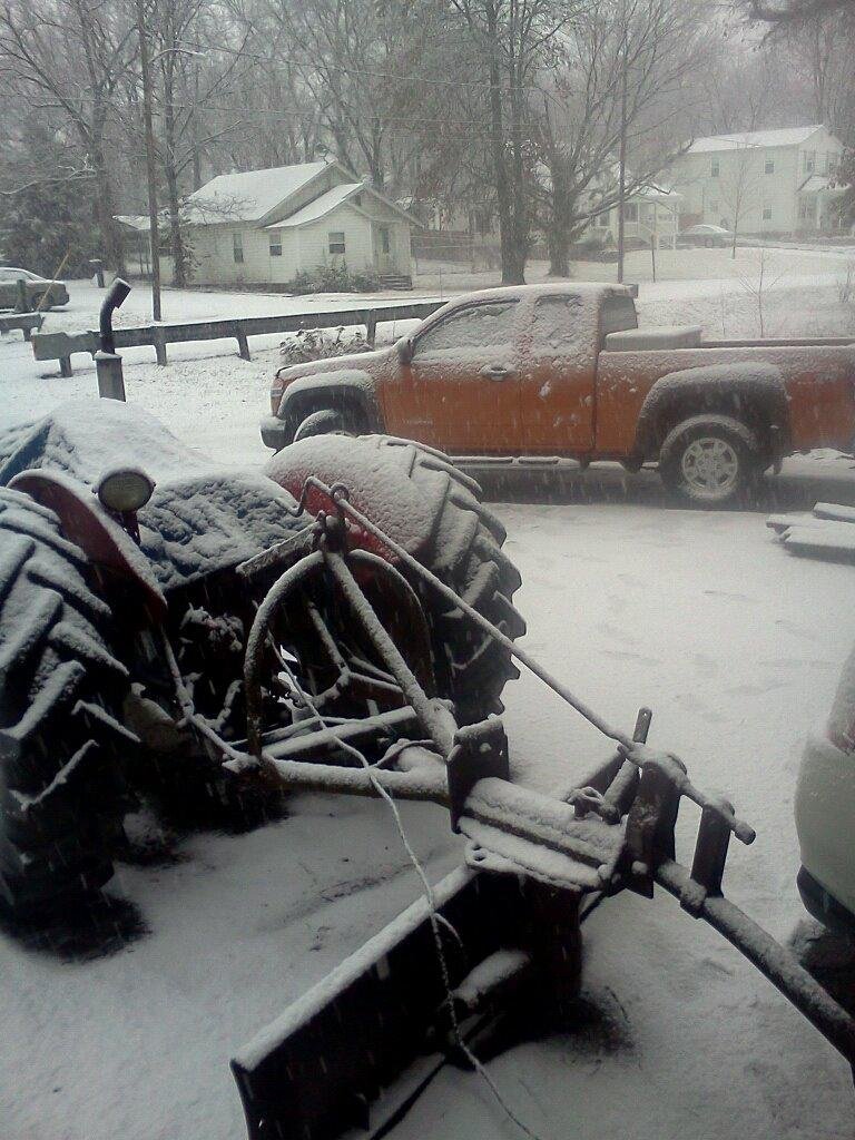 snow just starting old Massey 35 covered and ready to plow some