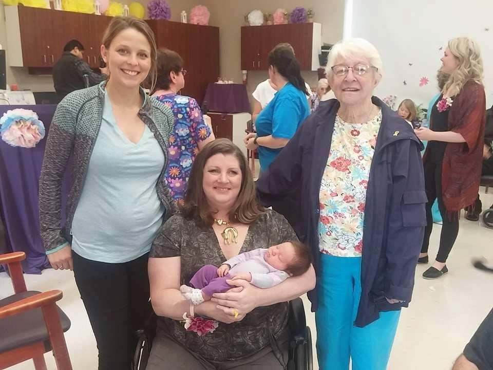 this is me, my grand daughter, my daughter and my mother at the fashion show where I live.