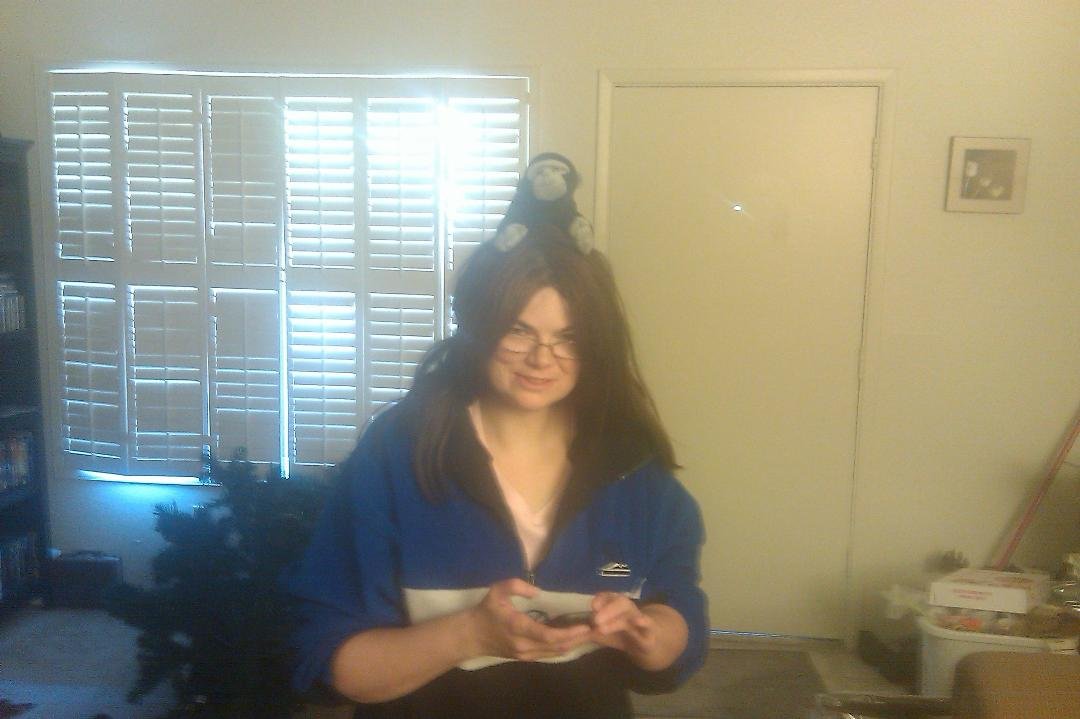 My wife with a monkey on her head