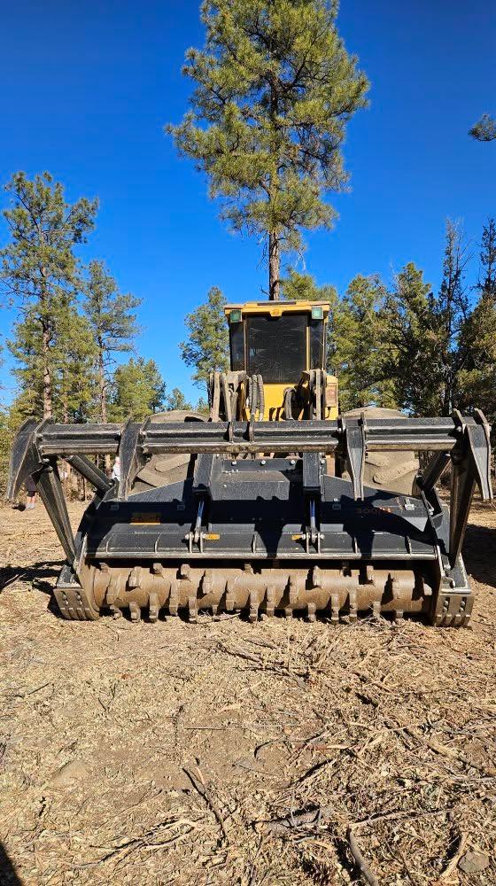 Masticator for clearing out forest brush and preventing fires.