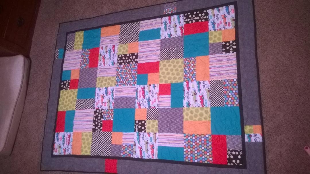 Just a fun quilt and pillowcase for my car and monster truck loving little guy.