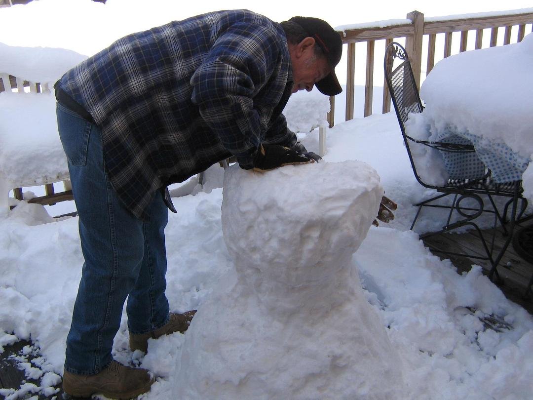 papaw building a snow man! this is what happens when he gets bored.