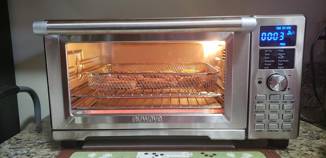 My new kitchen gadget toy, the NuWave XL Smart Oven. Many cooking feature. Frozen Parmesan crusted shrimp cooking here. Quick and easy. :)