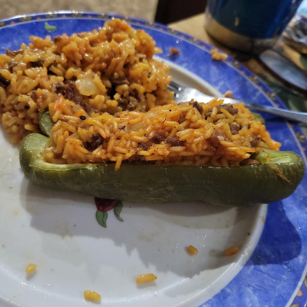 After mowing on the big tractor, it's hot. Mad a favorite of mine.
Stuffed panlona pepper from garding.
Rice cooked normal but el Goya season, cooked smoked sausage onions hamburger together with chopped onion. I take a lar