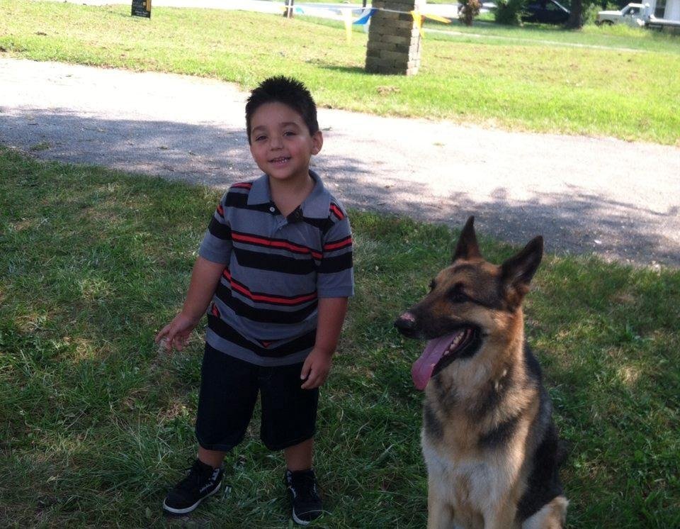 Waiting on his school bus with his dog (kush)