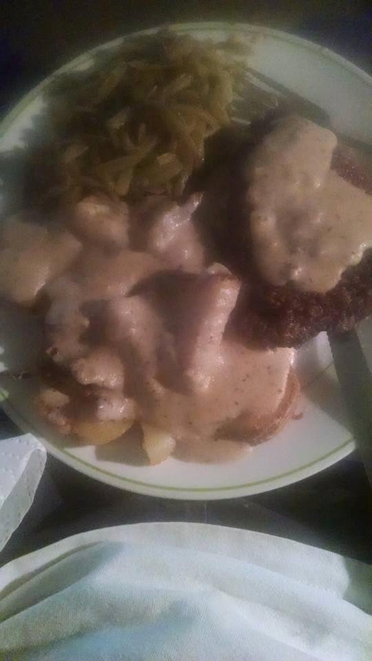 Dinner time chicken fried steak top sirloin tenderized fried potatoes gravy and green beans. Good eating.