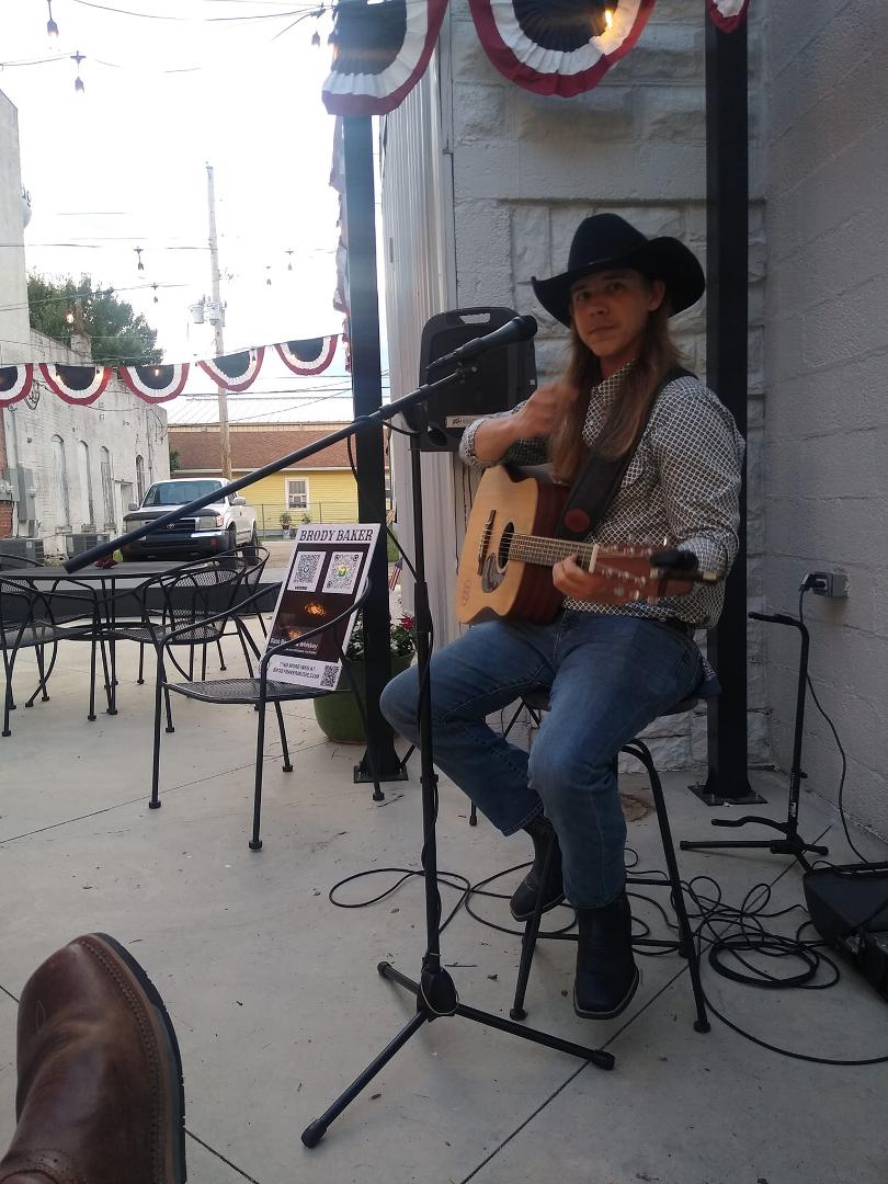 Tiffany and I Hanging out with my son, Brody Baker Music . Playing Sedgwick,ks. Proud of you son!!