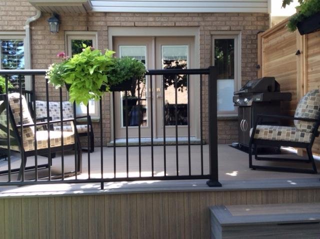New deck for my birthday. No stairs to navigate to get at the BBQ, and a lot more comfort and privacy. And installed artificial turf over the former concrete patio. The dogs love it.