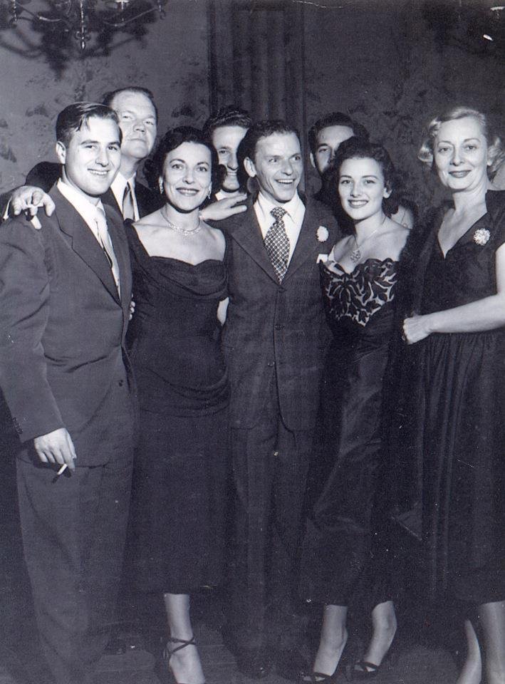Taken at Toots Shor NYC 1950 L-R my father Lenny, my grandmother Rozzy, some crooner, my mom Cindy and her aunt Rita (whose husband was the crooners agent) don't know the lugs in the back