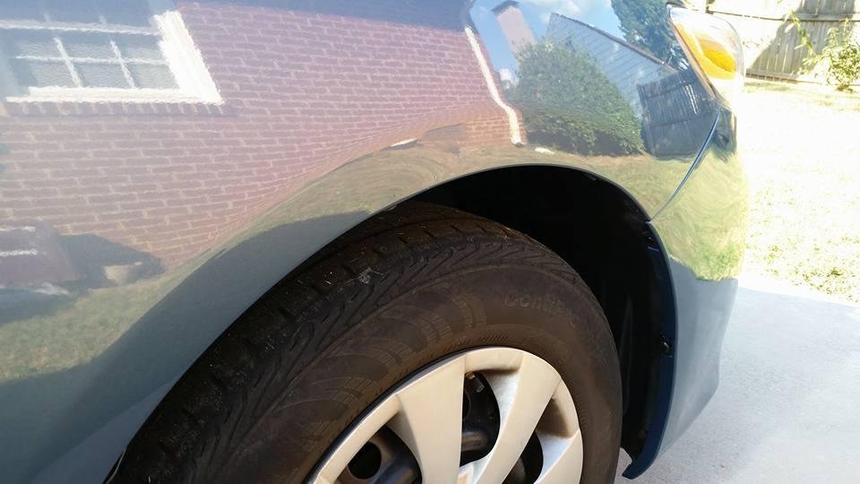 Notice anything missing?  The duct tape holding the front bumper on is gone!  After about 8 months, I decided it was time to get it fixed.  Thanks, Woody's Body Shop in Burlington for a good job, and fast too.... Took it in