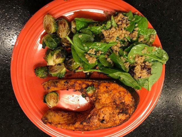 Salmon grilled steaks, roasted brussels sprouts, quinoa/spinach/sun-dried tomato salad. Salsa on the side.