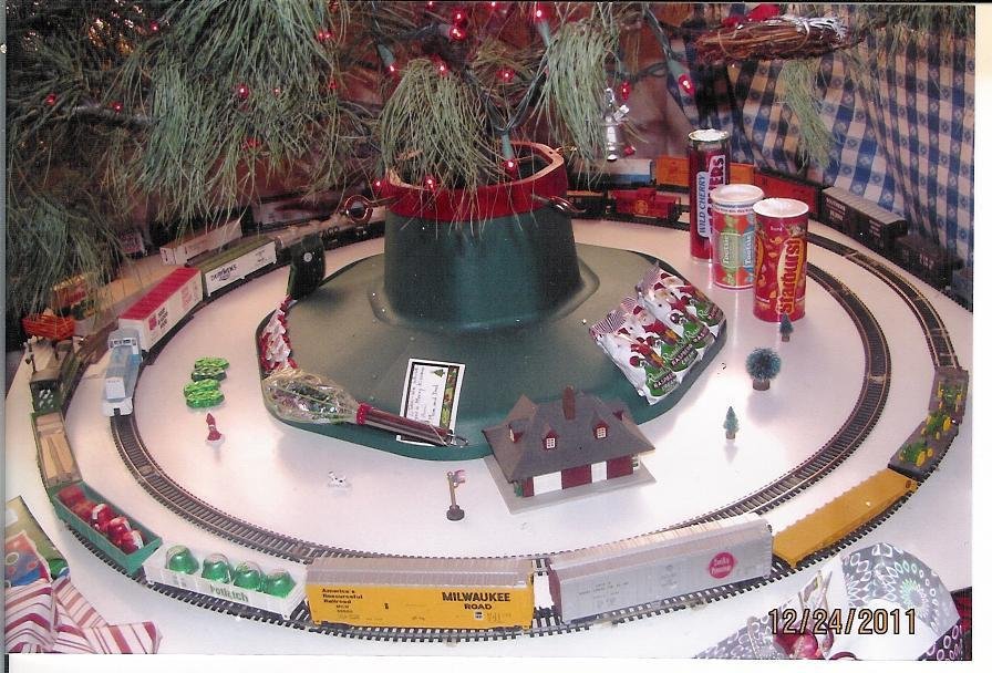 Look at the double train track under the tree on Christmas morning.