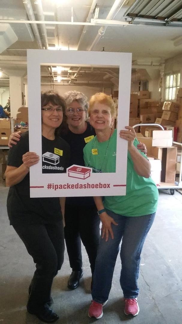We helped to pack lots of shoeboxes this past Saturday. Here is a photo.