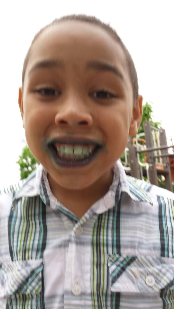 At the park after eating blue ice cream