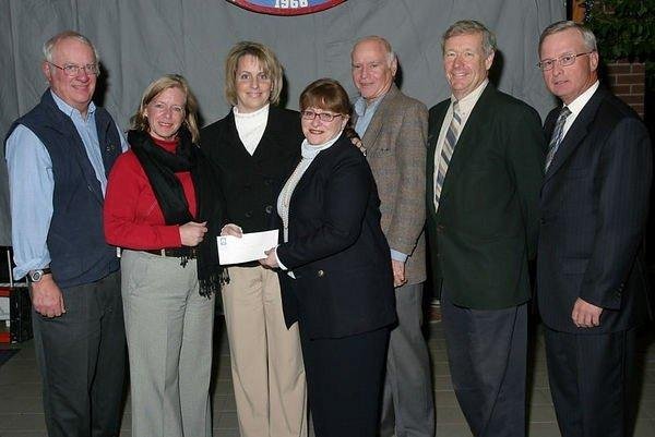 As a member of the West Island Community Resource Centre Board of Directors receiving a cheque from Pointe Claire Oldtimers Hockey Club which I play hockey with. Dec. 05.