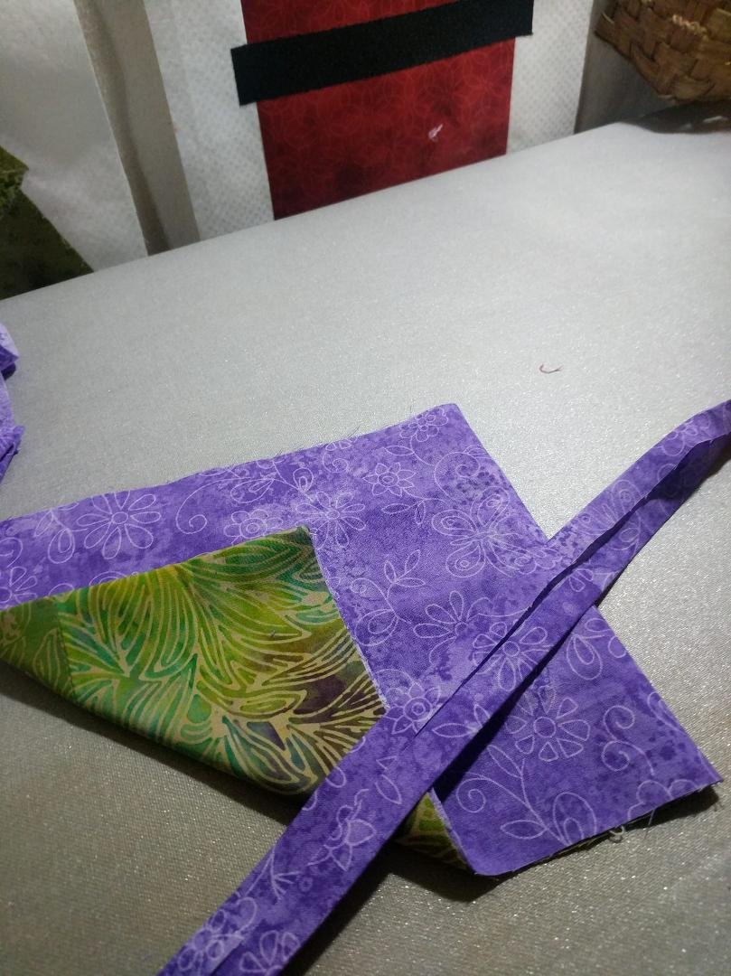 Jennifer Suzanne Short. Purple ties piece is making the tie out of fabric