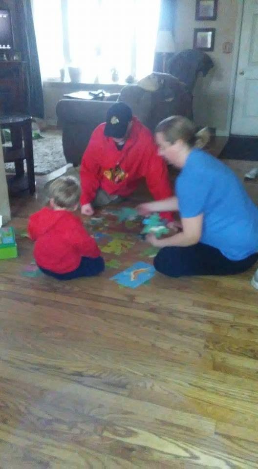 Henry doing BIG puzzle with mommy and daddy.