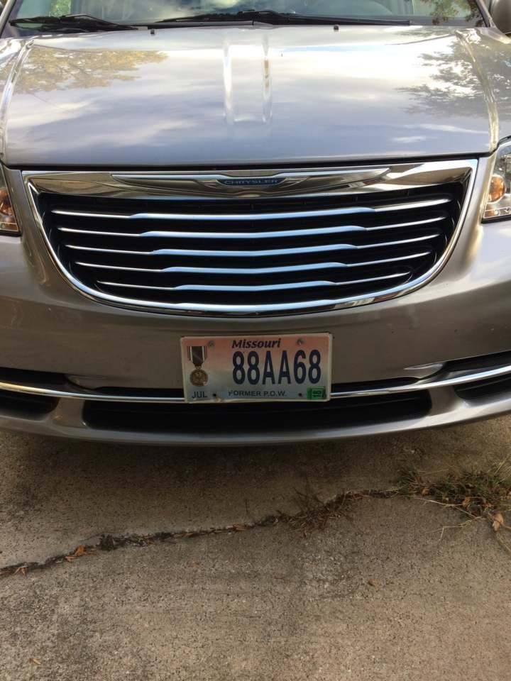 This is the front of a "HERO'S" car.  Incase you can't read the small print at the bottom of the plate, it reads FORMER POW.  This is the car of my cousin Eugene, whom we just got back from visiting in Hannibal MO.