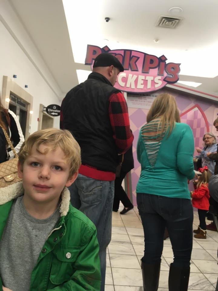 Charlie's first ride on Macy's Pink Pig! Making memories!